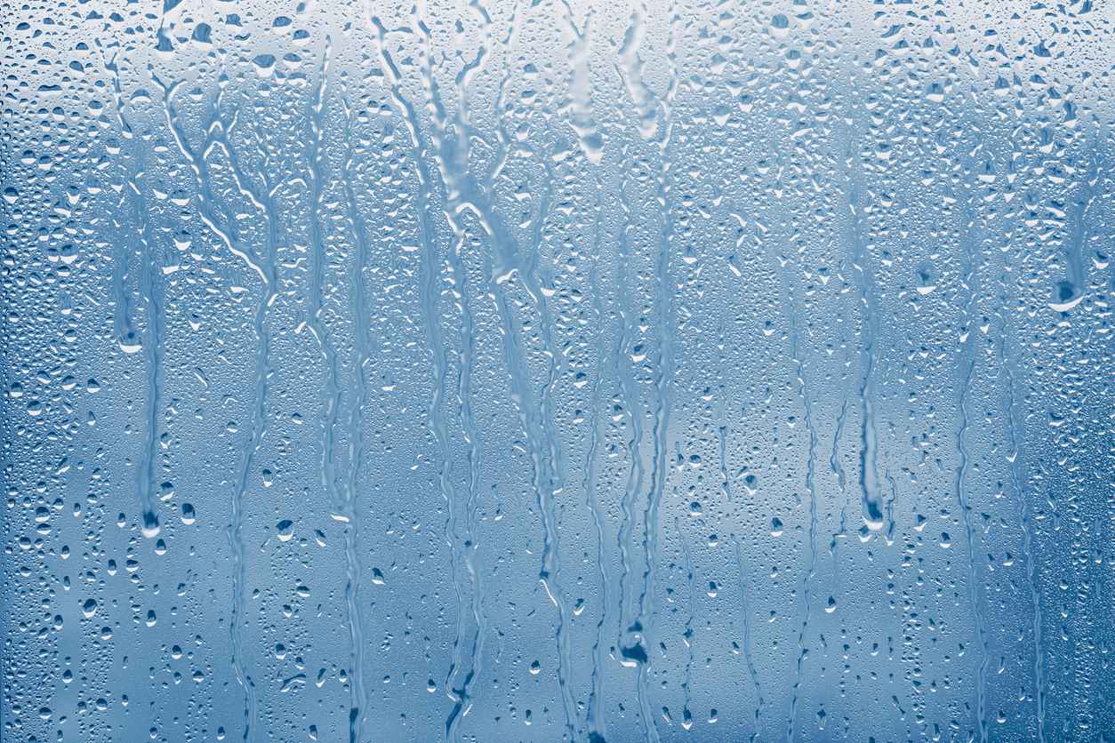 Condensation on glass window with water drops